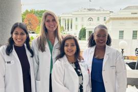 Sadia Haider, MD, MPH, smiling with colleagues at the White House