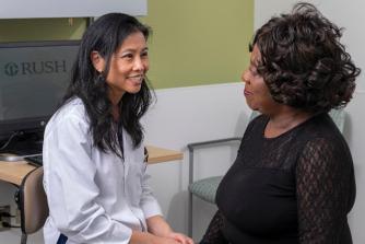 Gastroenterologist Salina Lee, MD, with a patient